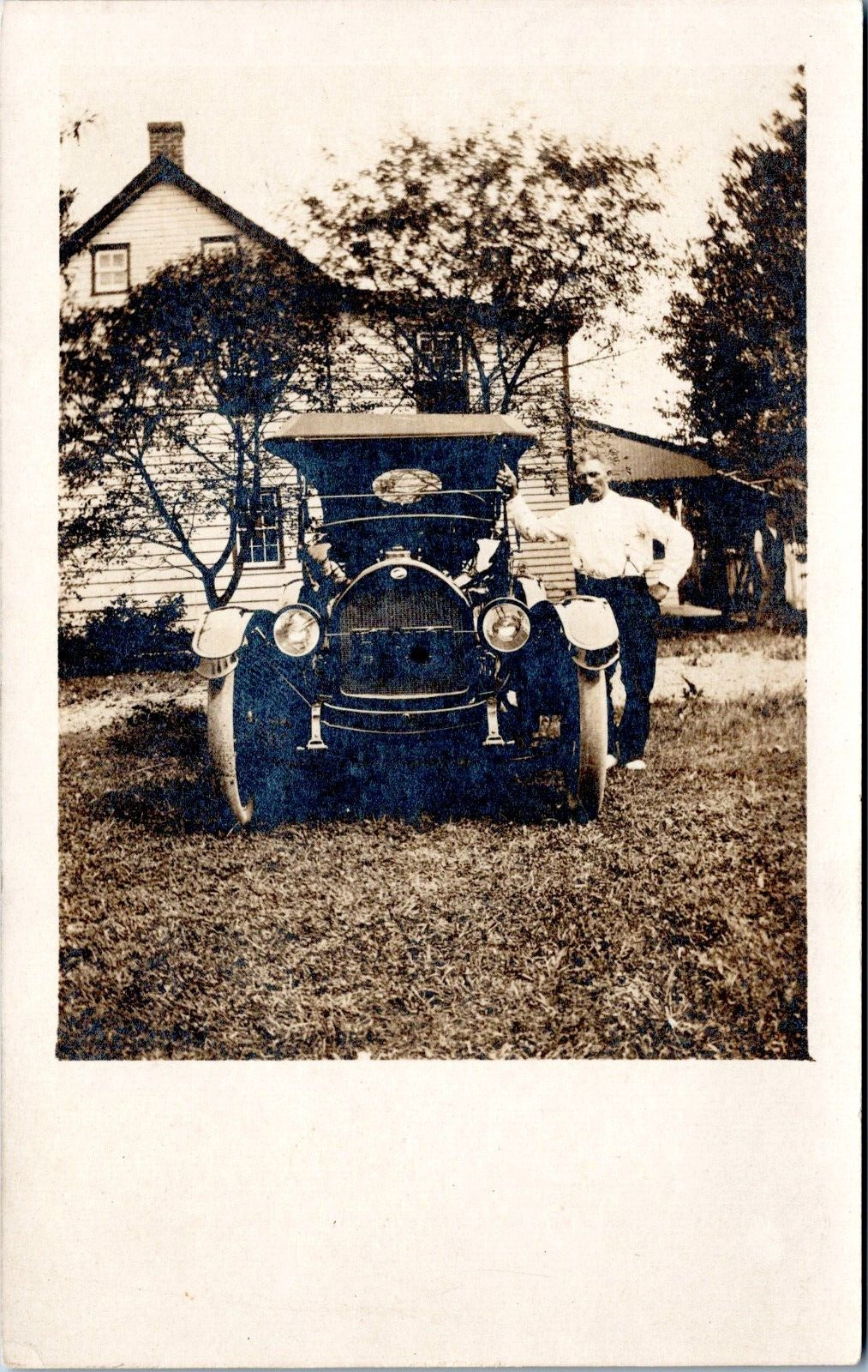 RPPC Man in Suspenders pose next to Car - c1910s-1920s Photo Postcard