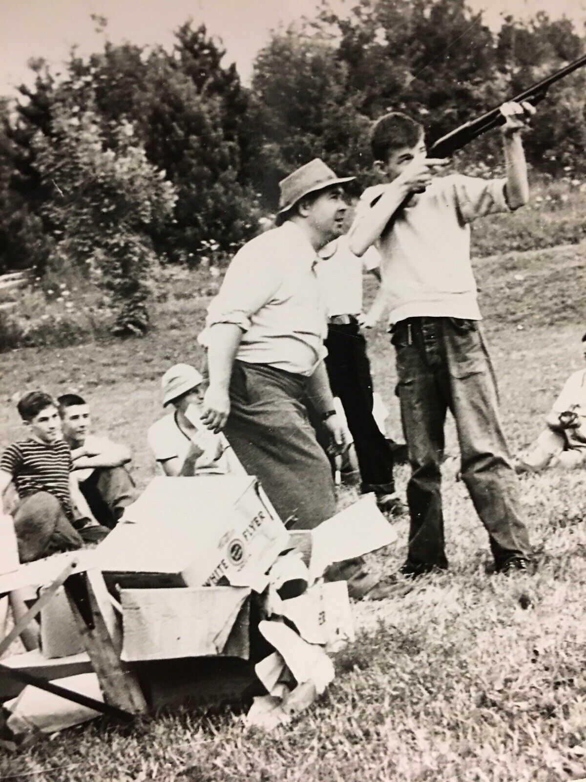 Vintage Black & White Photo 1950s Boys Shooting Practice Skeet Guns in Field