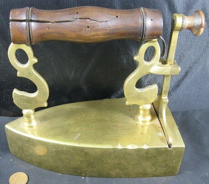 Antique Early Brass Slug Iron With Lift Gate & Stylized Dolphin Posts