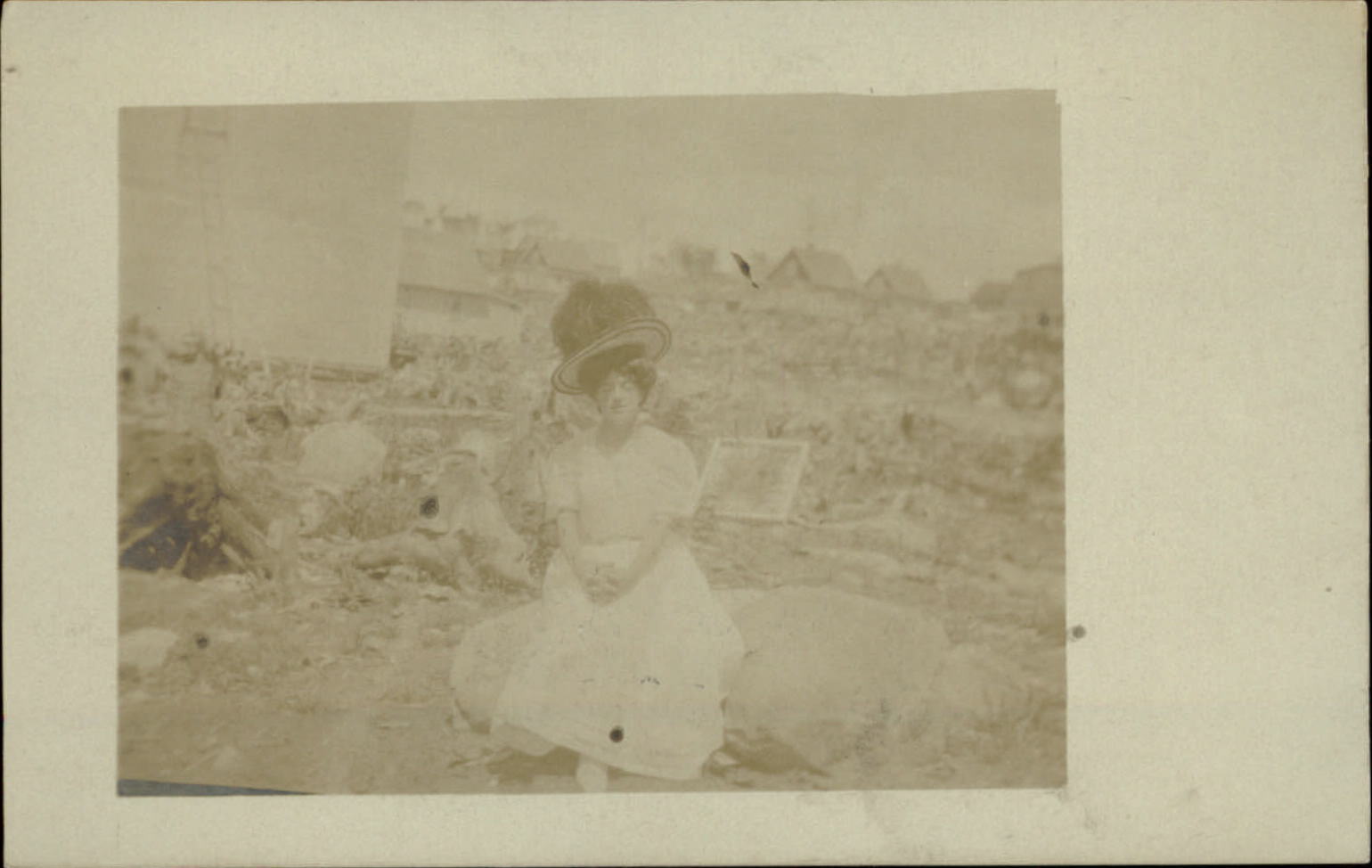 RPPC Young woman sitting on large rock huge hat ~ real photo postcard