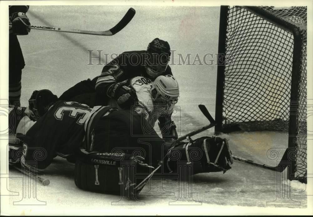 1994 Press Photo Mike Strobel in a pile, Wisconsin & Denver WHCA Hockey Game