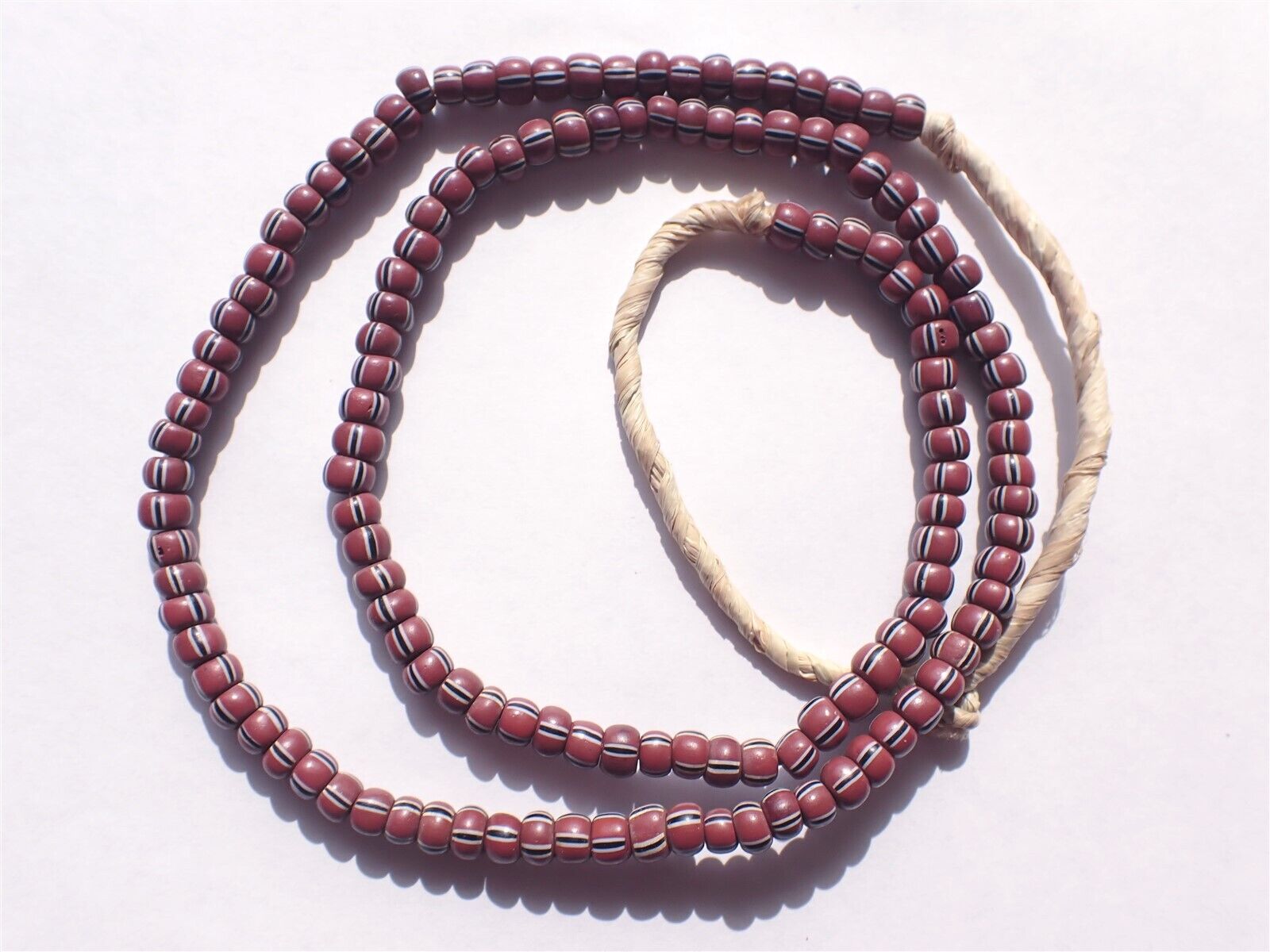 Antique Striped Pony Trade Beads, Brown w Bk/White- 5-5.5mm - Strand
