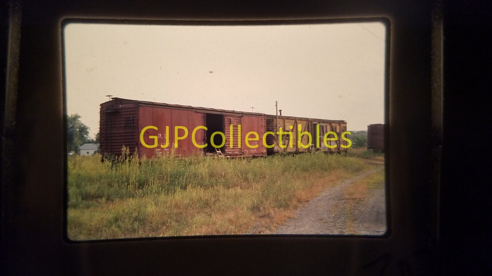 20710 35MM Train Slide ENGINES CARS STATIONS ROCK ISLAND BOXCAR OVERGROWN