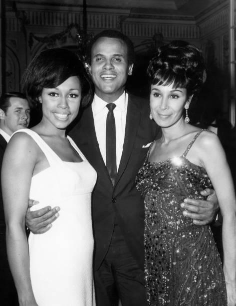 American actor and singer Harry Belafonte poses with his wife d - 1965 Old Photo