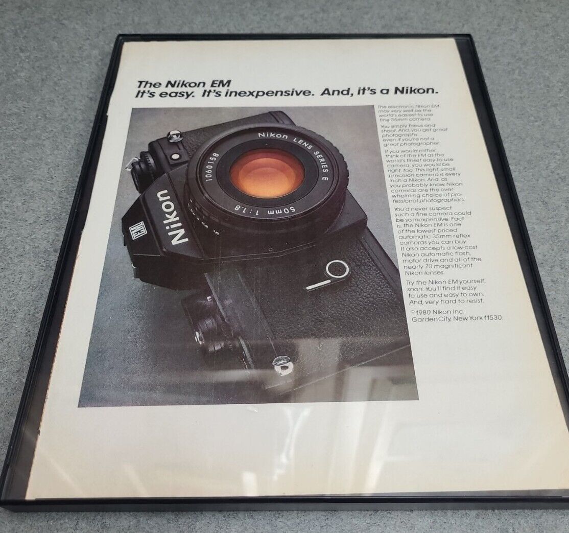 1980 Nikon EM Camera: Its Easy Its Inexpensive Vintage Print Ad Framed 8.5x11 