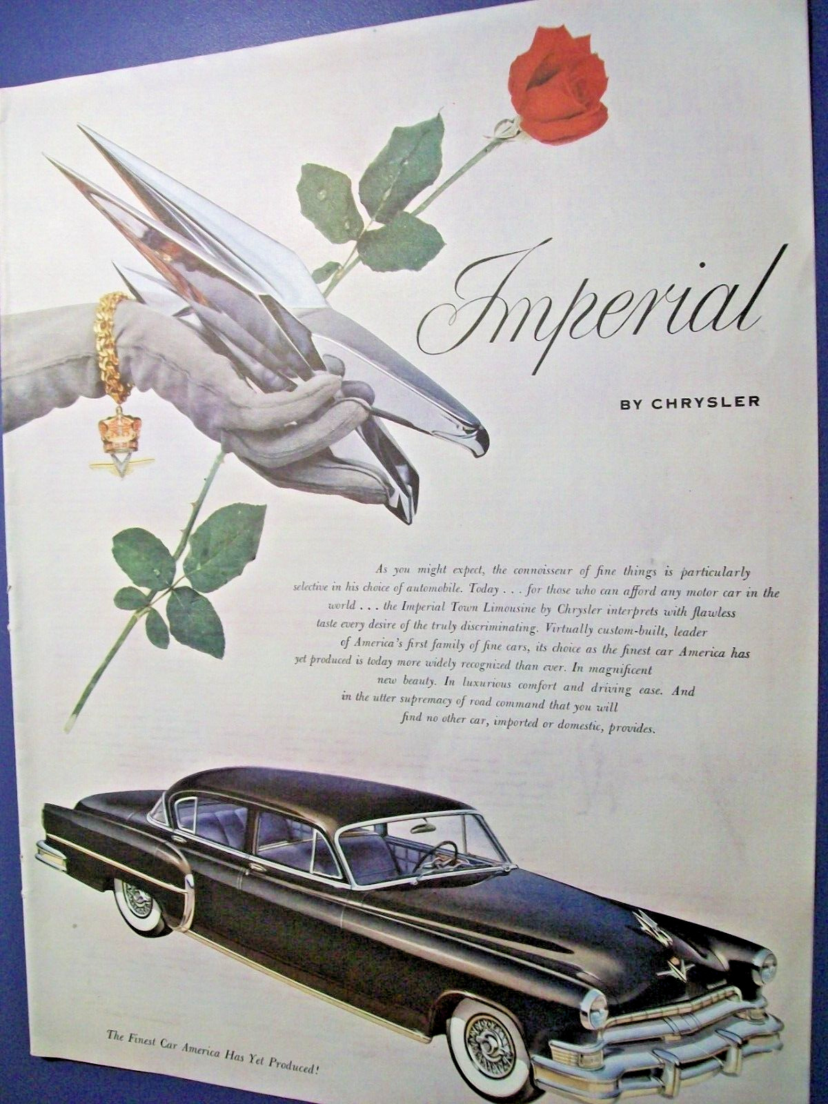 1953 Chrysler Imperial large-mag car ad -hood ornament in model\'s hand
