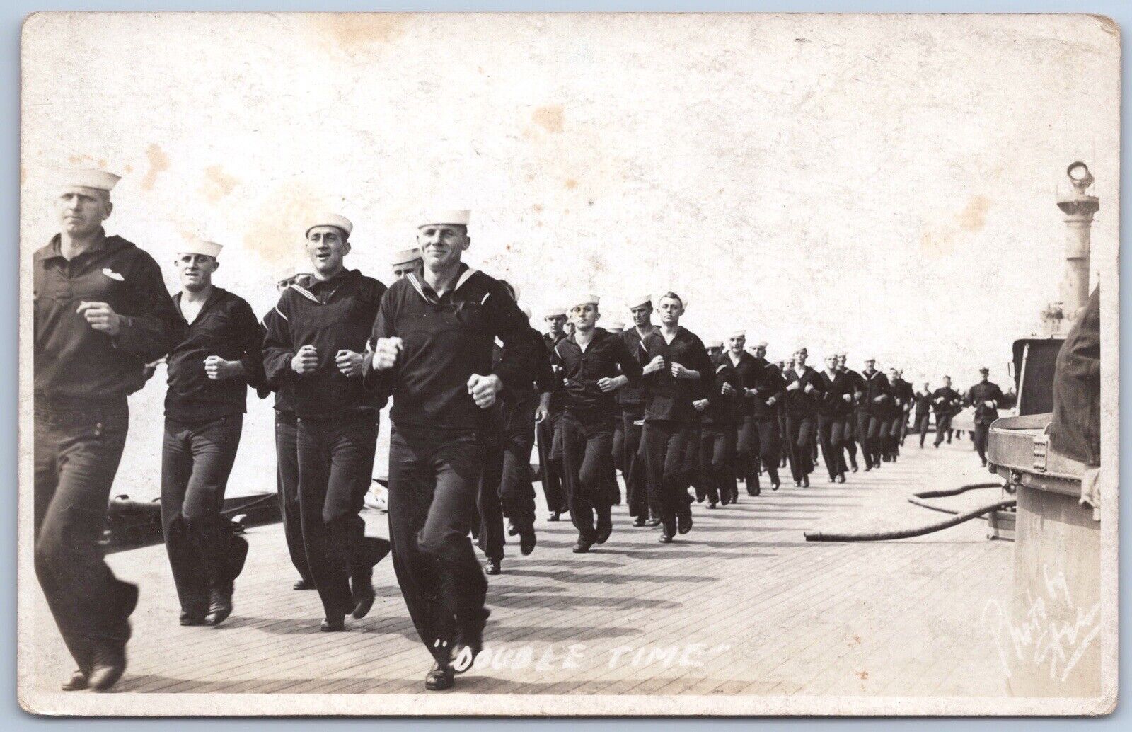 handsome navy men jogging on ship deck navy sailors rppc unp