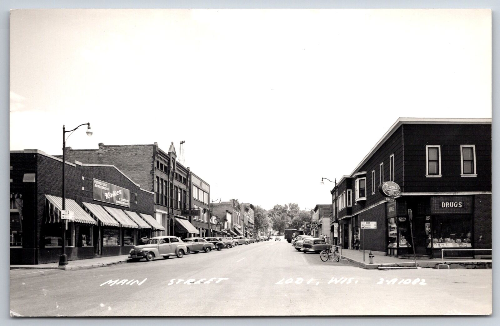 Lodi Wisconsin~Main Street~Koltes Furniture~Rexall Drug Store~1940s Cars~RPPC