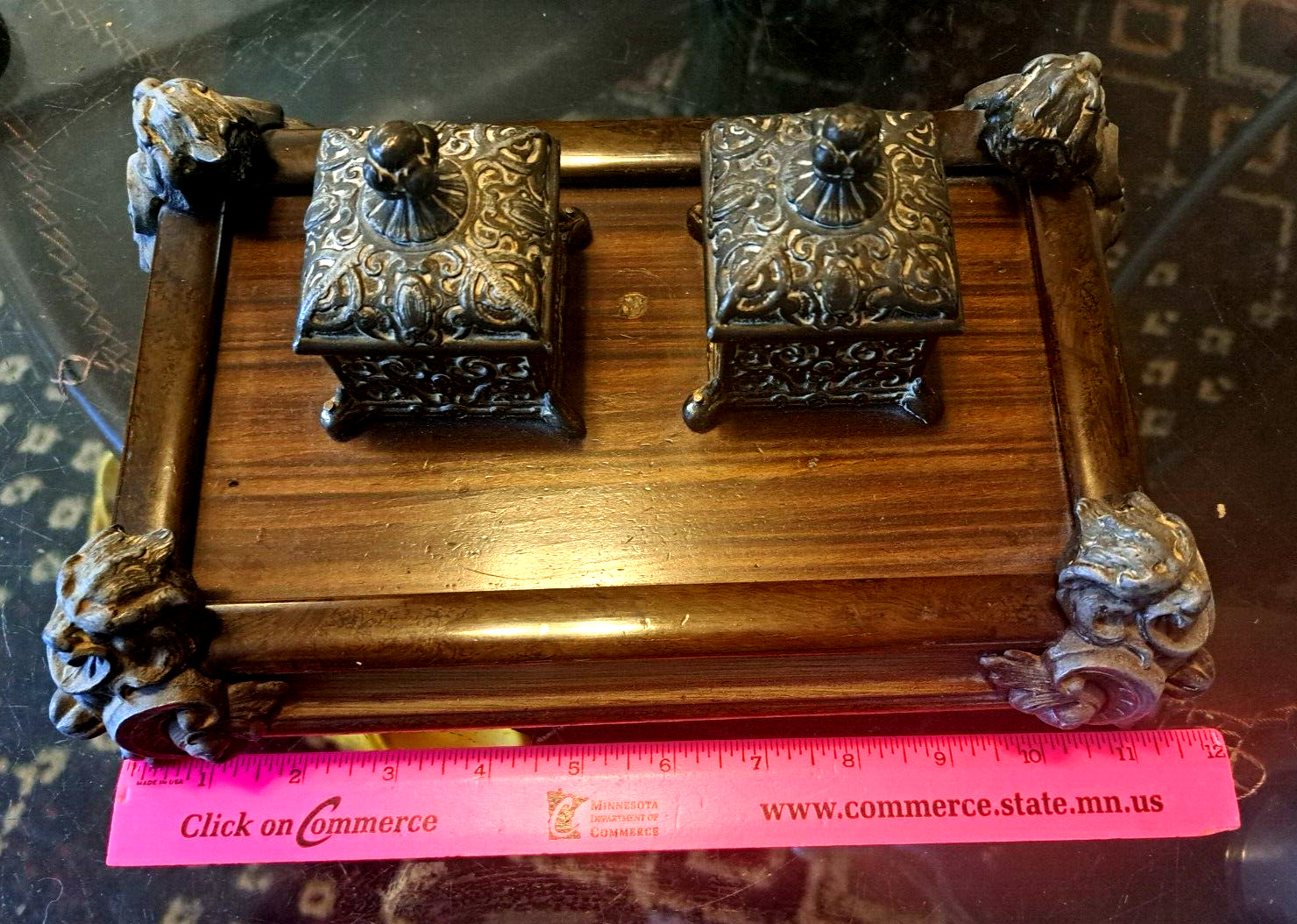 Antique metal and wood double inkwells with gargoyles on each corner