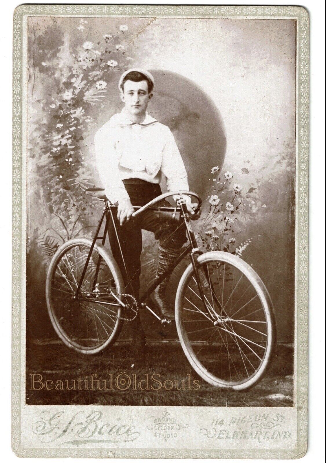 Antique Cabinet Card Photograph Handsome Young Man on Bicycle Flowers Elkhart IN