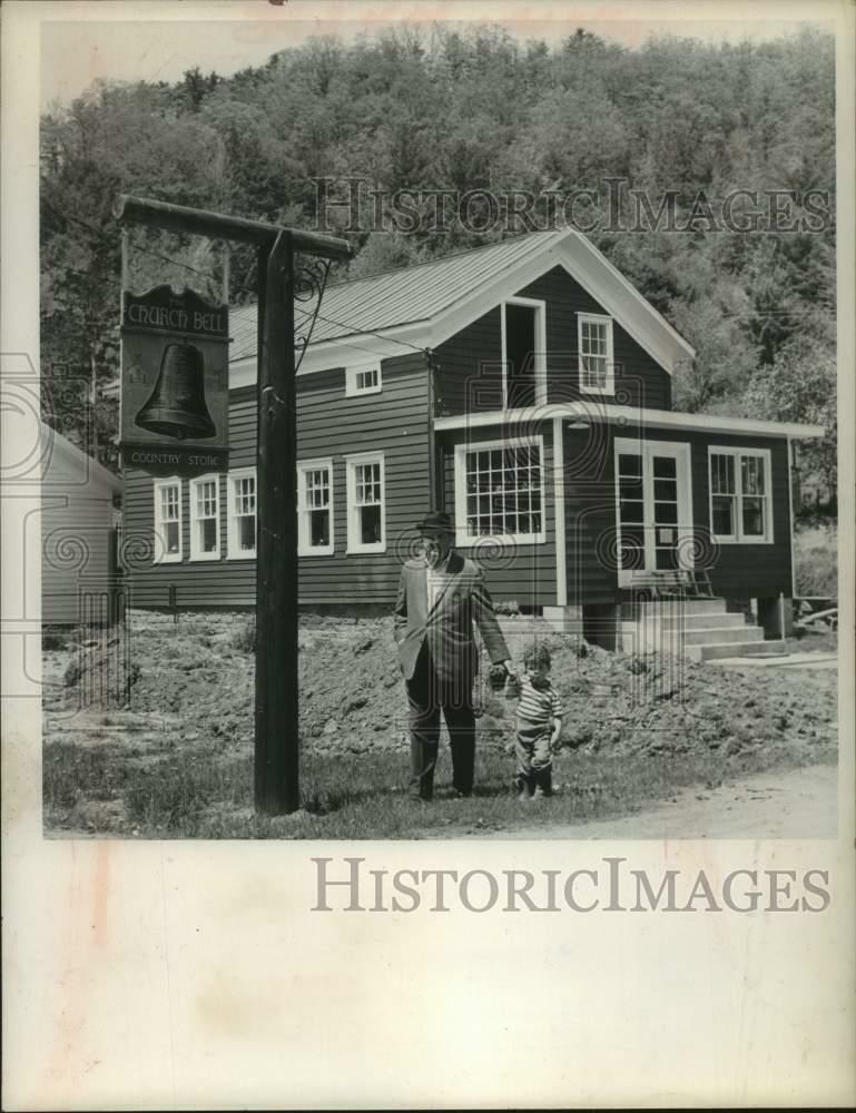 1964 Press Photo Actor John McGiver & son outside their New York antique shop