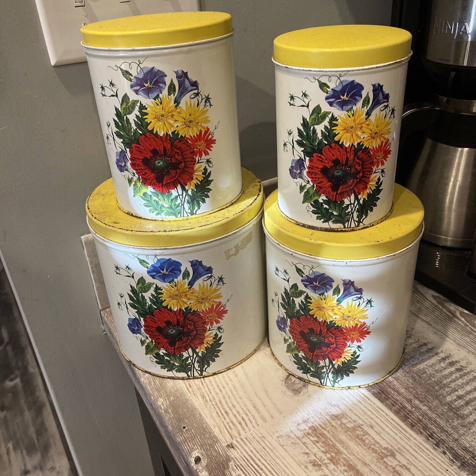 Set Of 4 Nesting Canisters Vintage Metal Yellow Lids Flowers