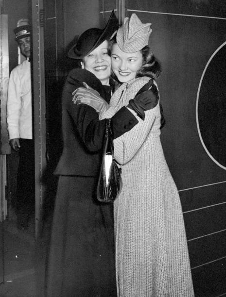 Hometown girl Gene Tierney gets a big hug from her mom at Penn Sta .. Old Photo