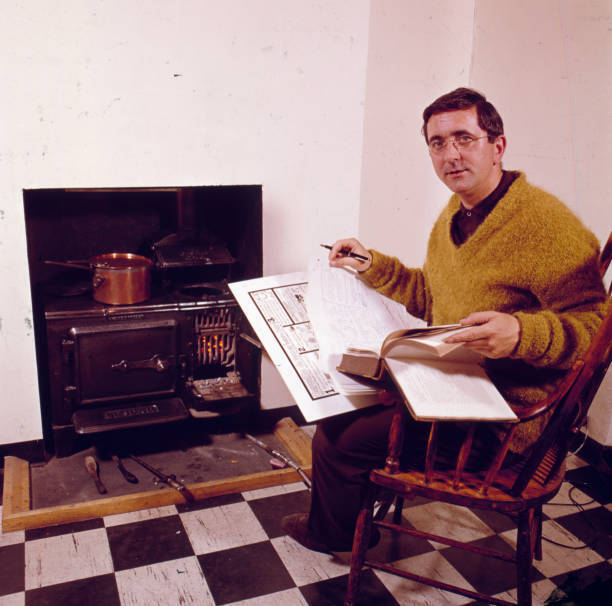 English Historian And Author Len Deighton Posed With Books And 1960s Old Photo