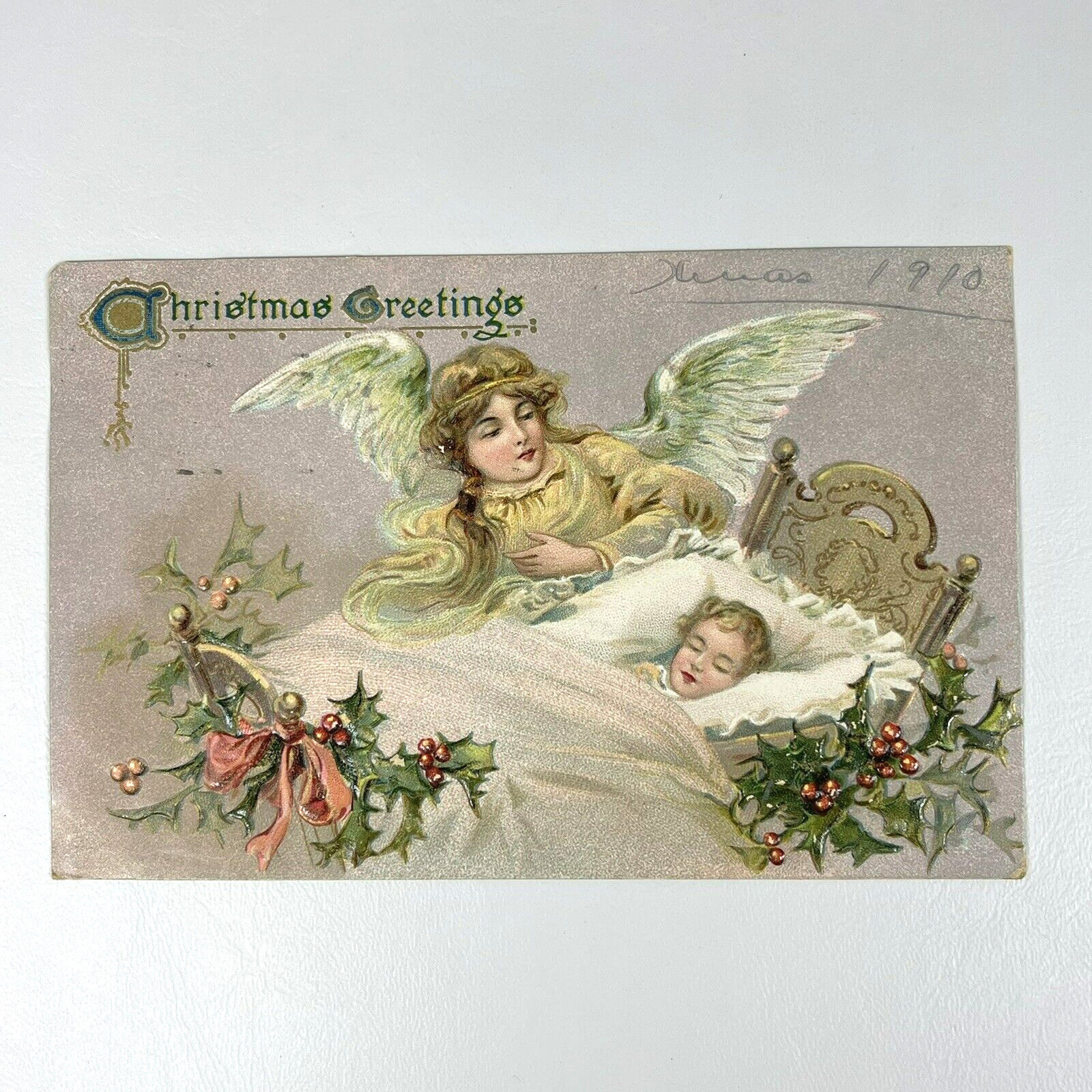Postcard Christmas Greetings Tucks Embossed Angel Tucking In Baby Holly 1910