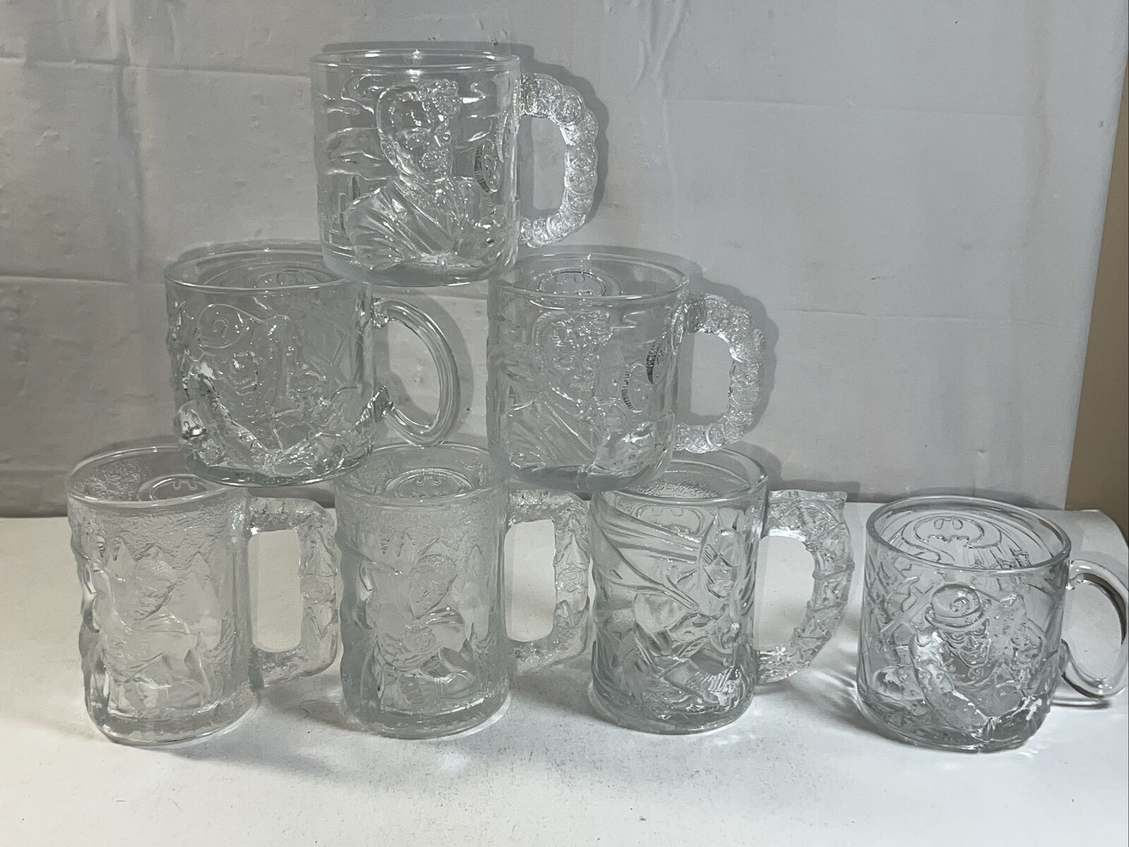 Set Of 7 McDonalds BATMAN FOREVER Embossed Glasses Mugs Cups 1995 DC (Read)