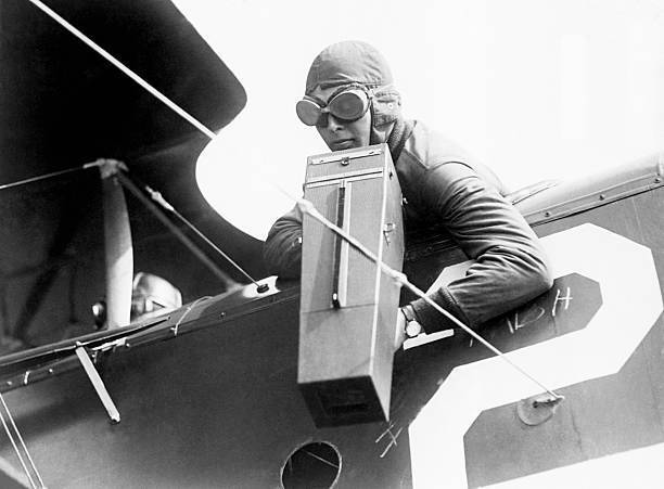 The co-pilot plane takes photograph using an Aeroplane Graflex came- Old Photo