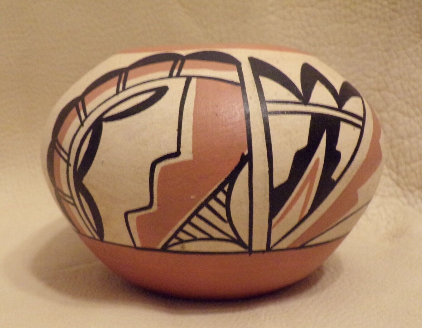 Jemez Pueblo, New Mexico pottery olla with a stylized bird design by C G