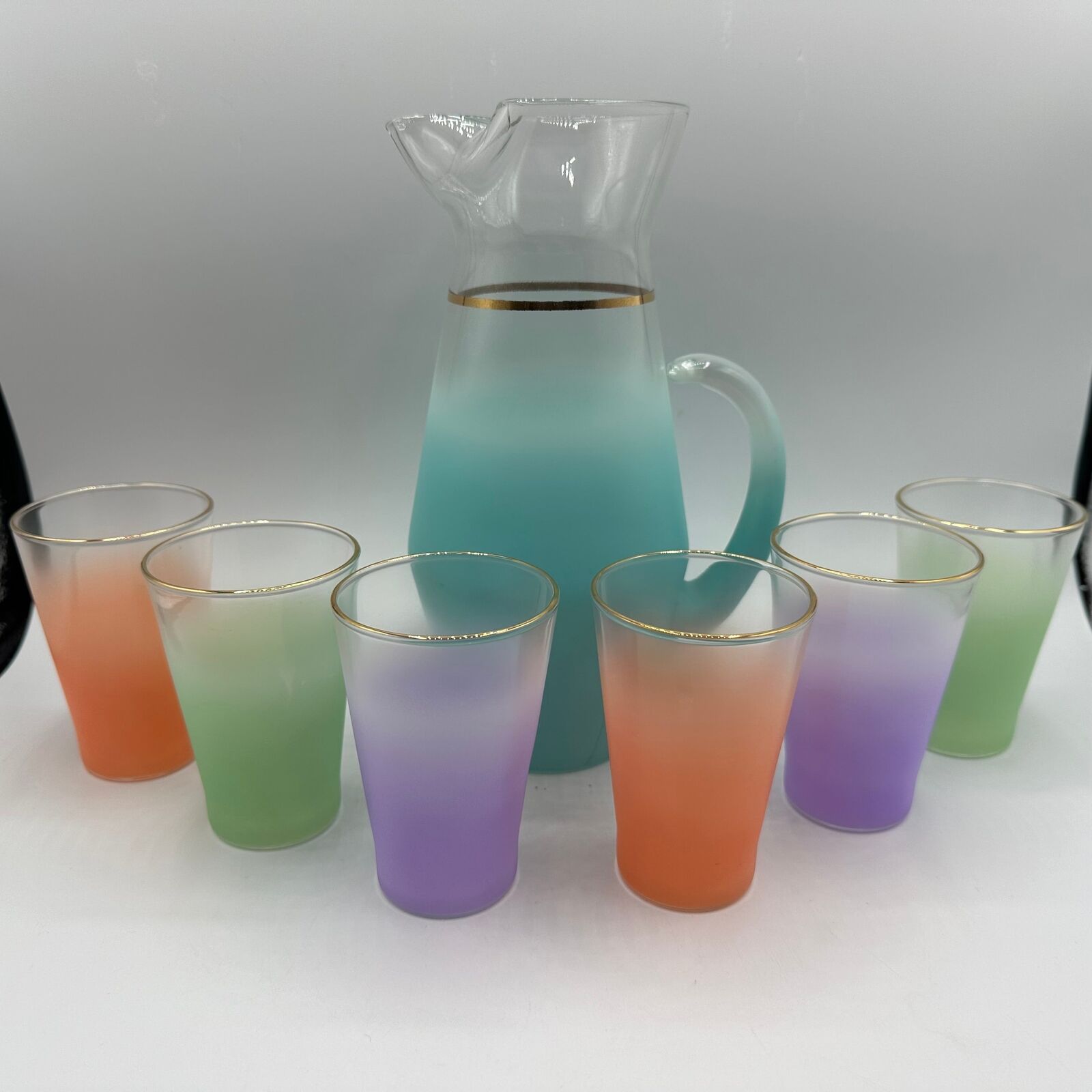 Blendo Blue Pitcher and 6 glasses- 2 purple, 2 orange, 2 green