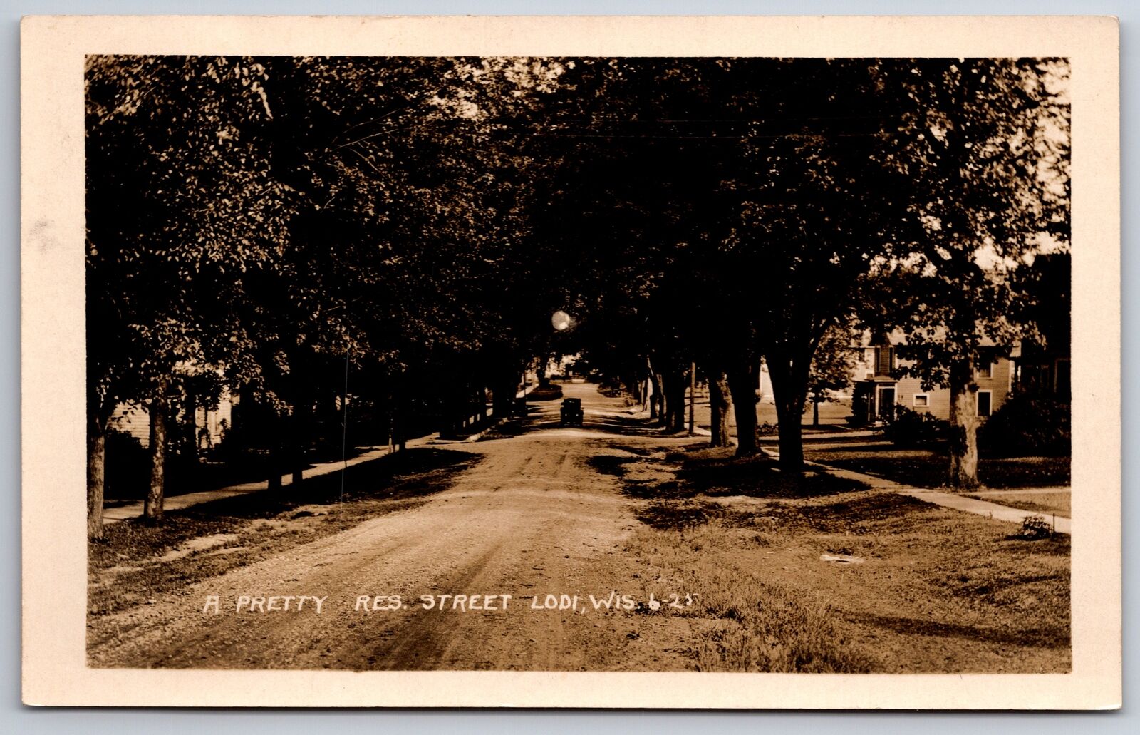 Lodi Wisconsin~Tree-Lined Dirt Rd Residential St~Set-Back Home~Auto~1920 RPPC 