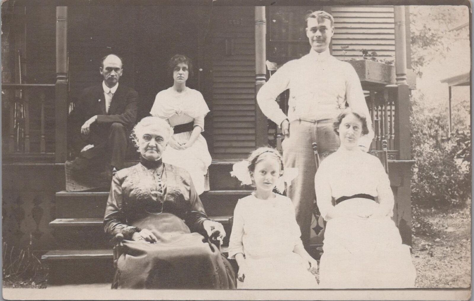 RPPC Postcard Porch Scene Multi Generational Family Sitting Outside Early 1900s 