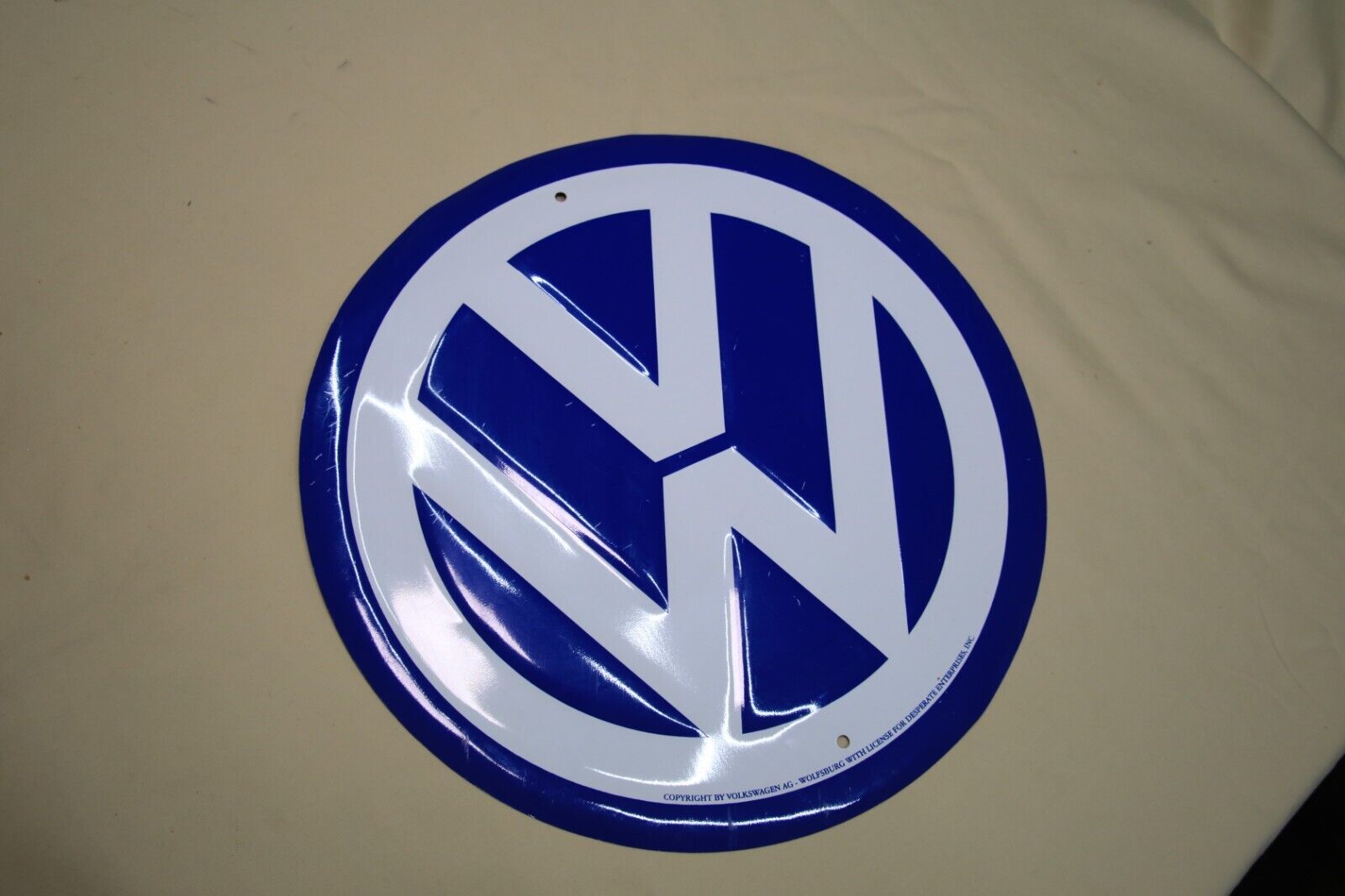 VW blue and white 11 1/2 inch diameter painted sign