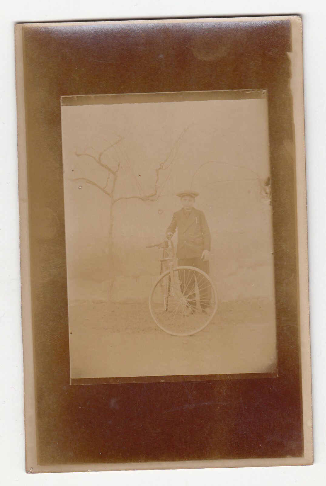 ***Boy riding a bike seen through a window ***SD - CPA 1270 Photo Card