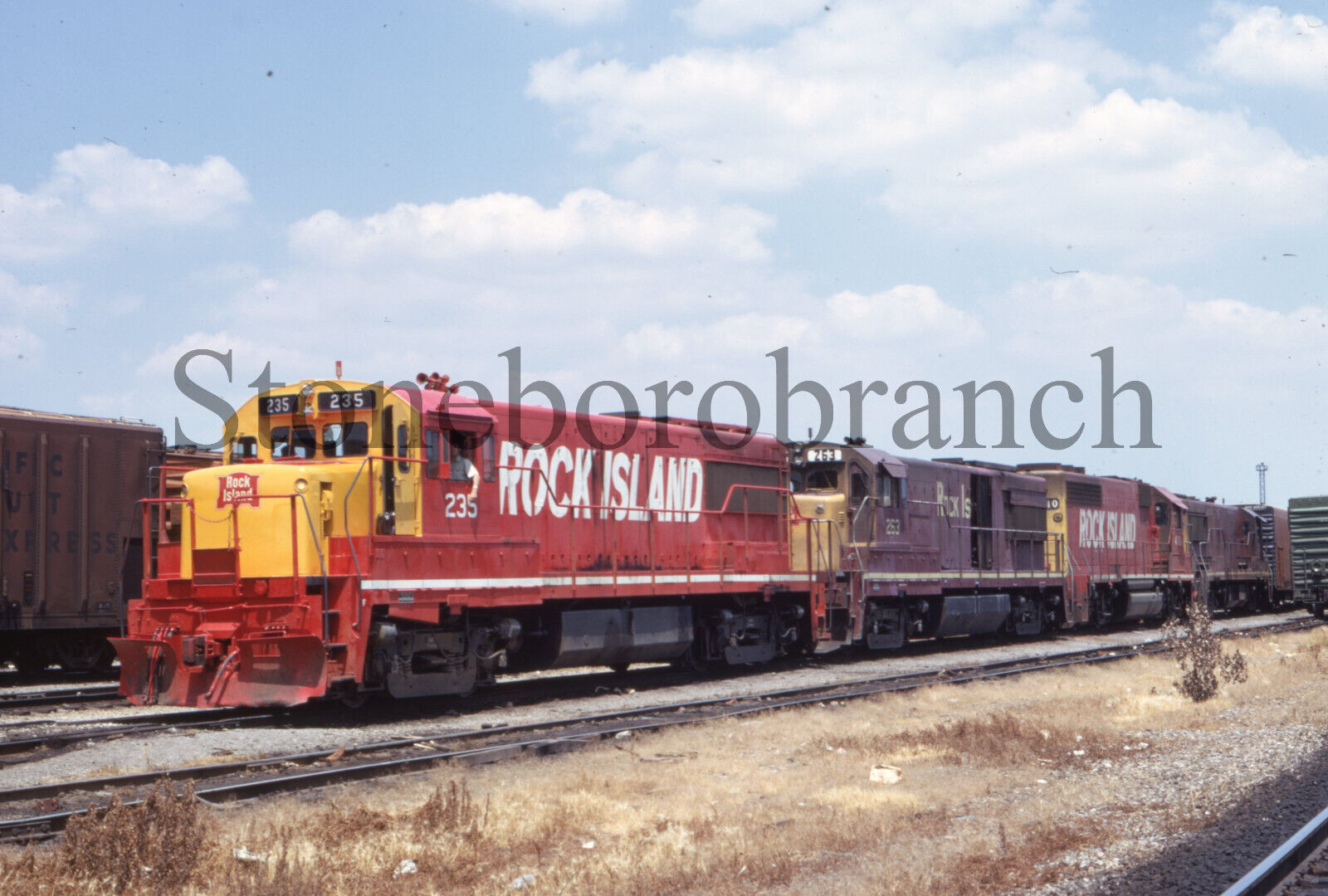 J.) Original RR slide: Rock Island U25B #235 GE power leading freight; 7/1971