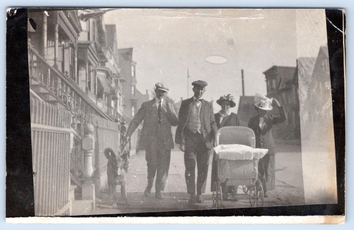 1915 RPPC NEWARK NJ STREET SCENE WICKER CARRIAGE DOG GERMAN TRANSLATED POSTCARD