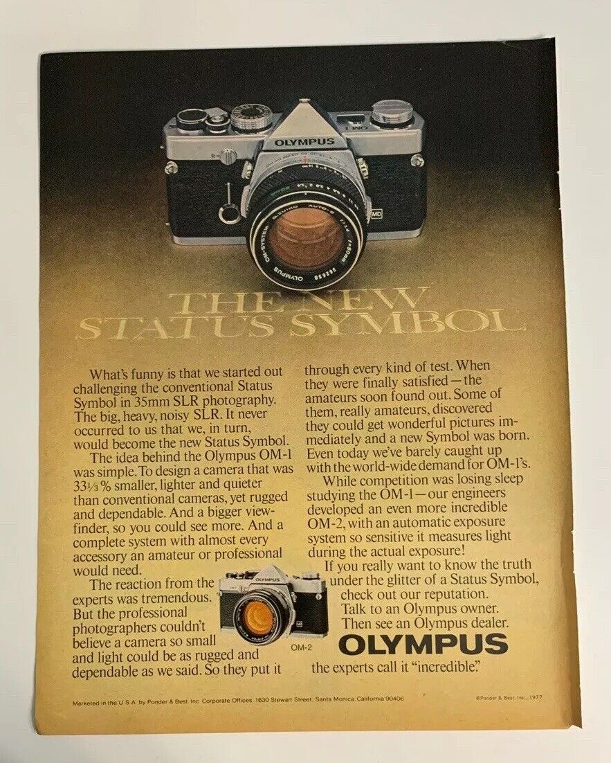 1977 Olympus OM-1 OM-2 Camera 35mm SLR Print Ad The New Status Symbol Vintage