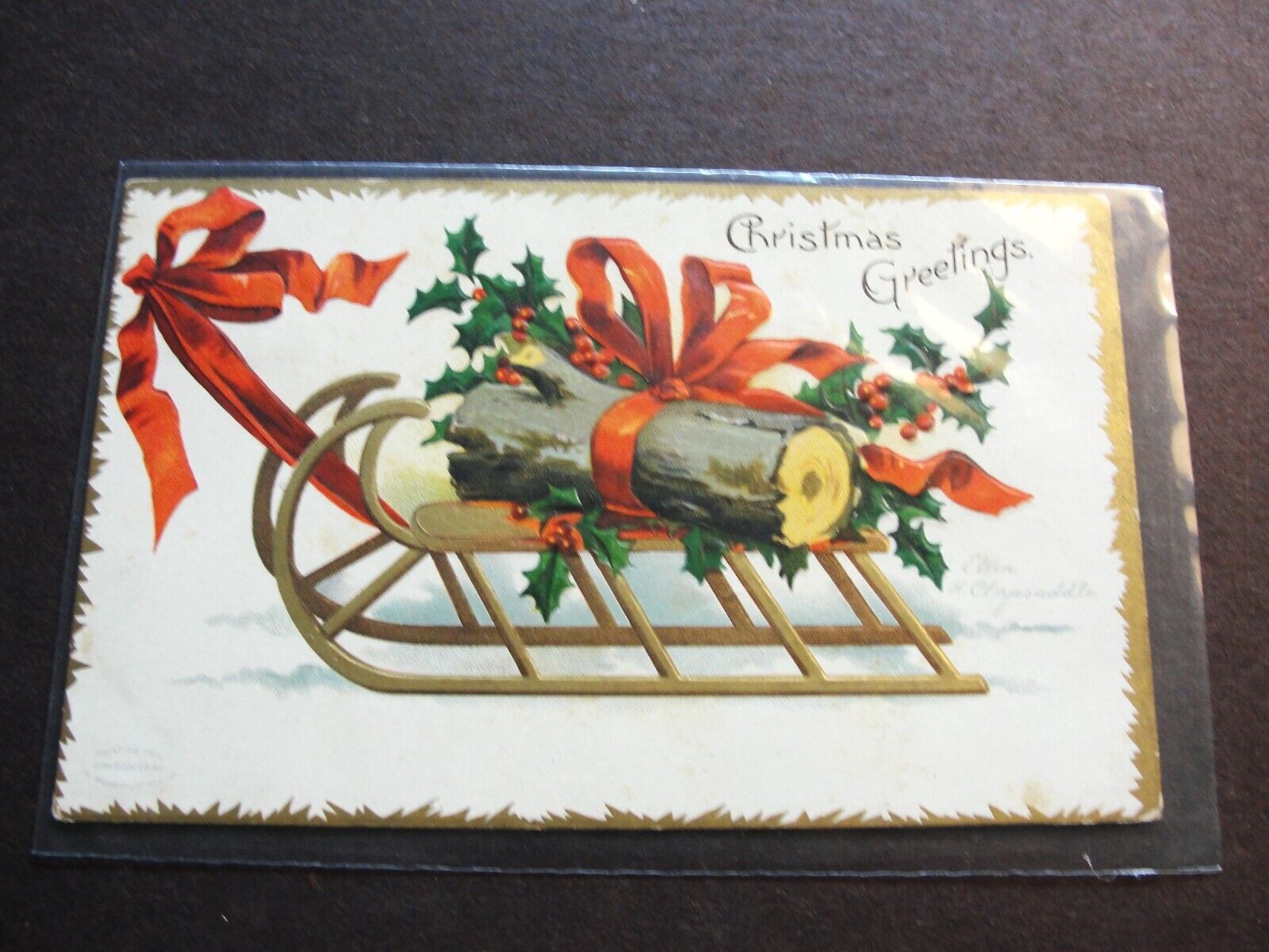 Christmas Greetings Happiness without limit -Postmarked 1907 Embossed Postcard.