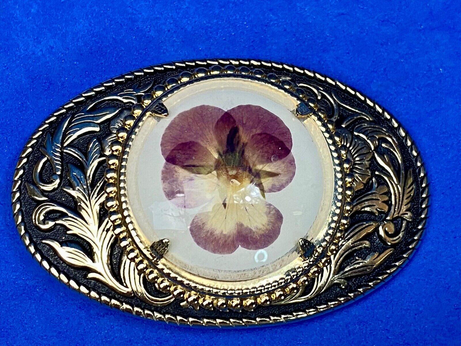 Beautiful pressed purple Violet flower as centerpiece in western belt buckle 