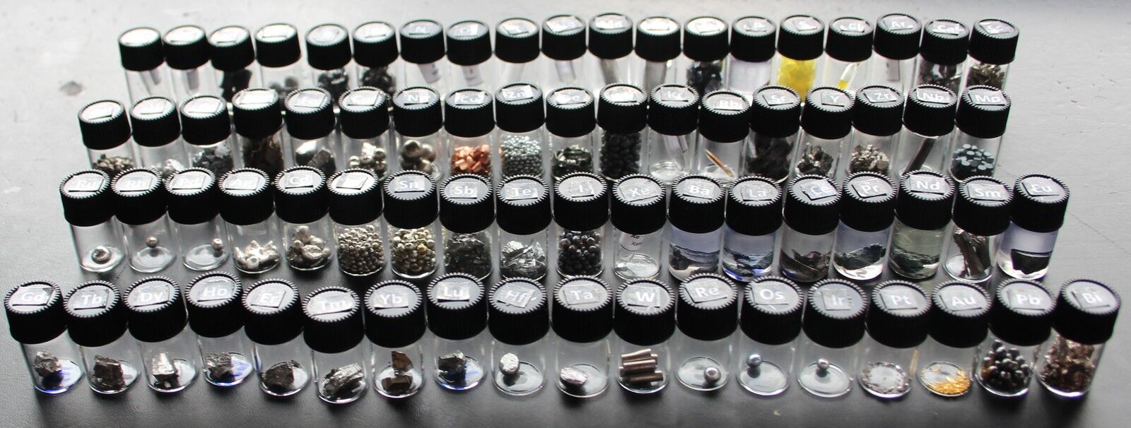 Set of 71 different pure periodic table element samples in glass vials 