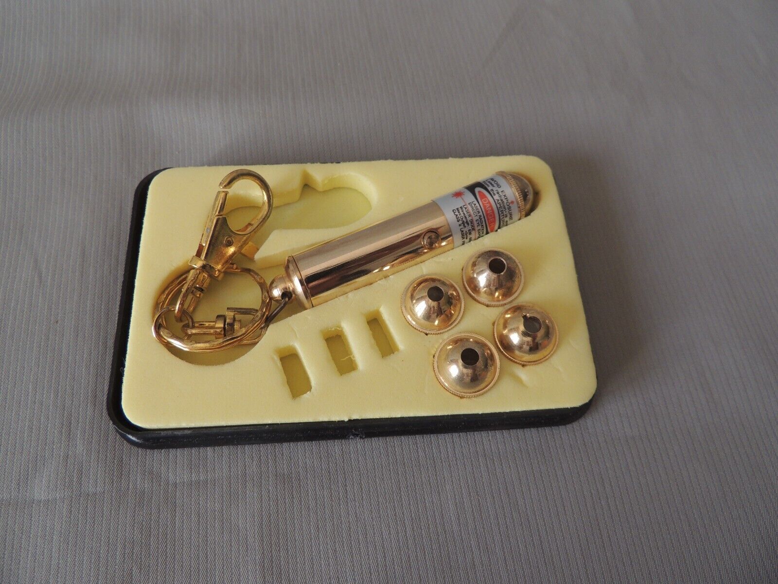 Bronze laser keychain 4 different sized heads maxell alkaline battery