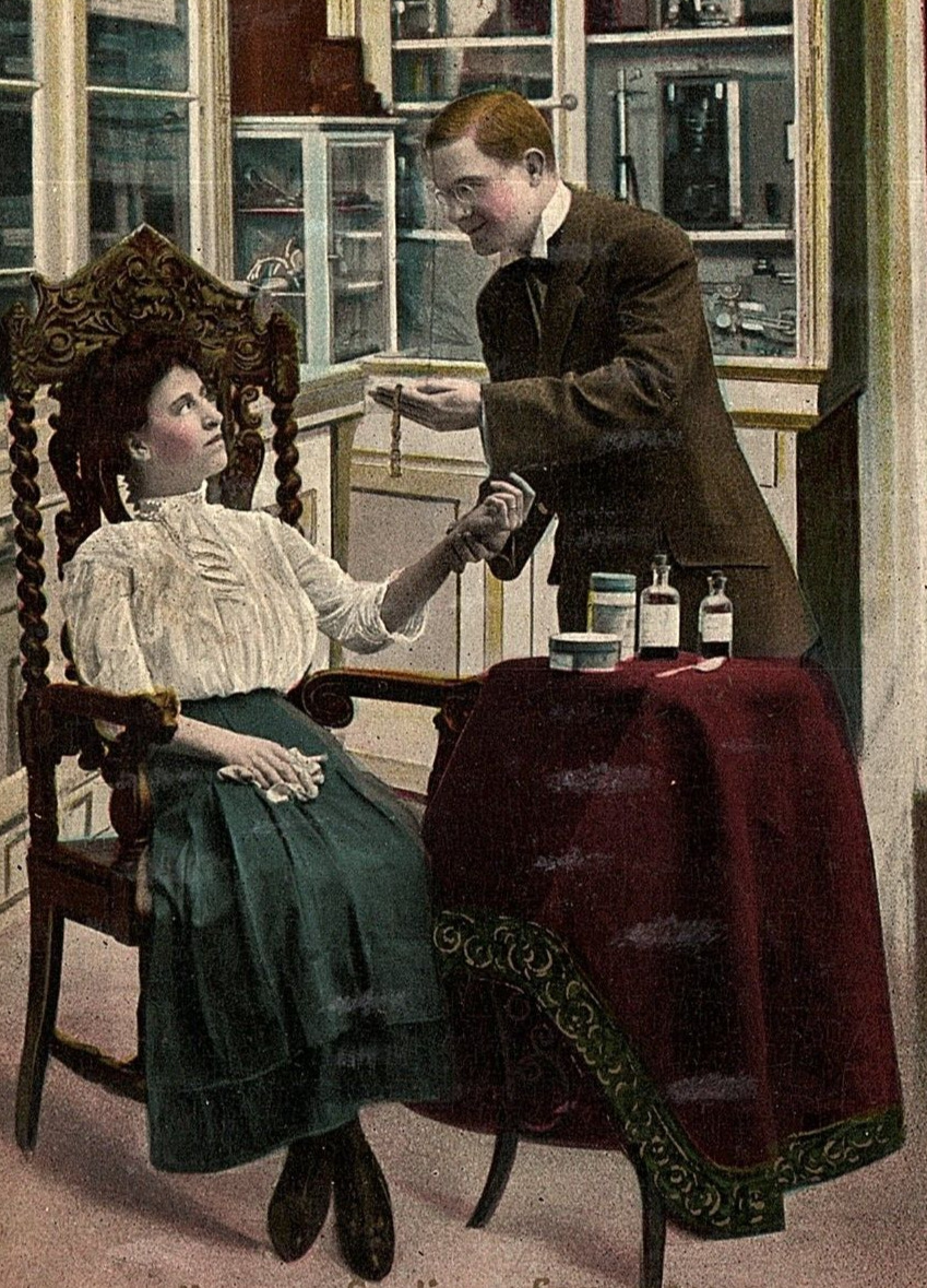 1908 DOCTOR IN OFFICE DRUGS TAKING PULSE PROPOSING TO FEMALE POSTCARD 46-69