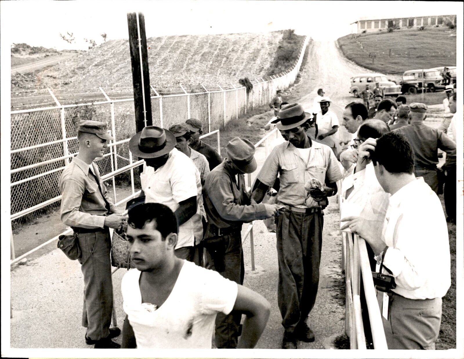 LG55 1965 Original UPI Photo CHECKING WORKERS US NAVAL BASE @ GUANTANAMO CUBA