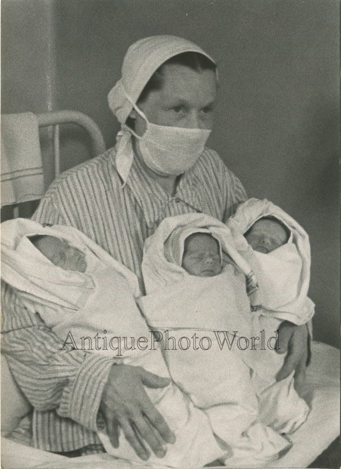 Nurse with newborn triplets vintage Soviet photo by Vladimir Gailis