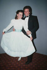 Sherilyn Wolter wearing a full-length white dress a pale blue sash- Old Photo picture