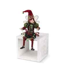 Christmas Sitting Elf With Wings Holding String Of Christmas Lights picture