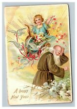 Vintage 1922 Tuck's Postcard Cute Angel Drops Flowers on Father Time White Doves picture