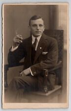 RPPC Attractive Man with Cigarette Seated for Portrait Postcard G29 picture