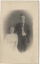 RPPC of Couple n Studio Looking Serious c1910  Real Photo Postcard picture
