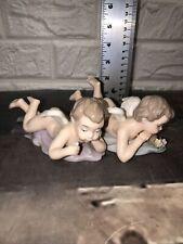 2 Vtg Porcelain Cherubs Angel Laying Foot Up  Figurines Hand Painted In China picture