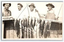 Fishing Mysterious Postcard RPPC Photo Man With Gun Pistol Weird Fishes c1910's picture