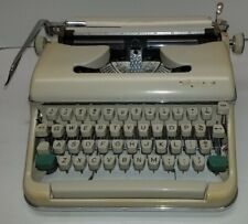 Vintage Olympia Typewriter with original case nice condition. tested picture