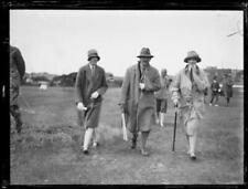 Golfer Ivo Whitton with an arm in a sling walking down the green w- Old Photo picture