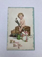 1910’s  New Year Postcard Child Sitting On A Trunk & Umbrella 1912i picture