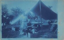 Cyanotype Man Cleaning Chickens Outside Tent c1910 Postcard picture