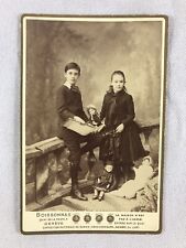 Brother and Sister with Her Dolls Photo picture