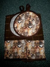 Cats packed kitchen towels and potholders picture